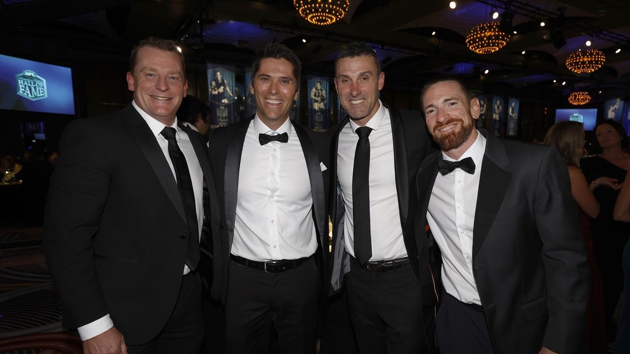 Rarely-seen footy superstars, partners shine