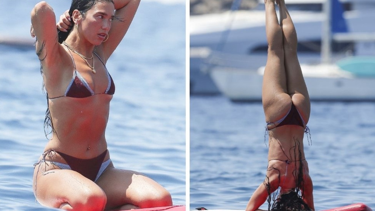 Dua Lipa shows off yoga moves on paddleboard in Ibiza holiday snaps