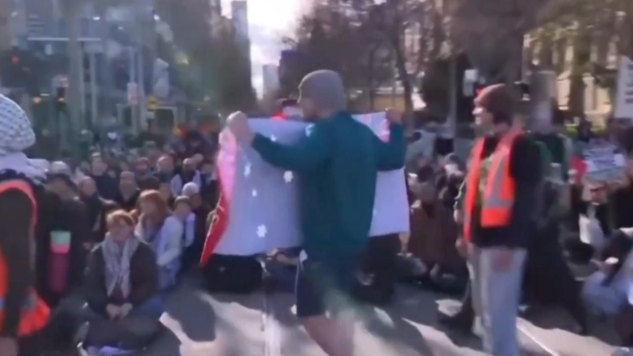 ‘Absolutely disgraceful': Video captures attack on man holding Australian flag
