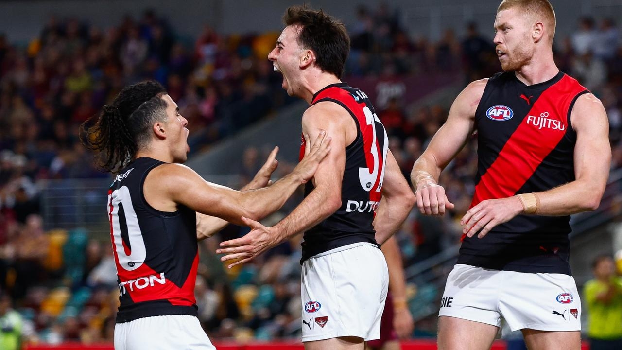 Essendon coach Brad Scott leaves Brisbane a happy man after leading reigning premiers in final quarter