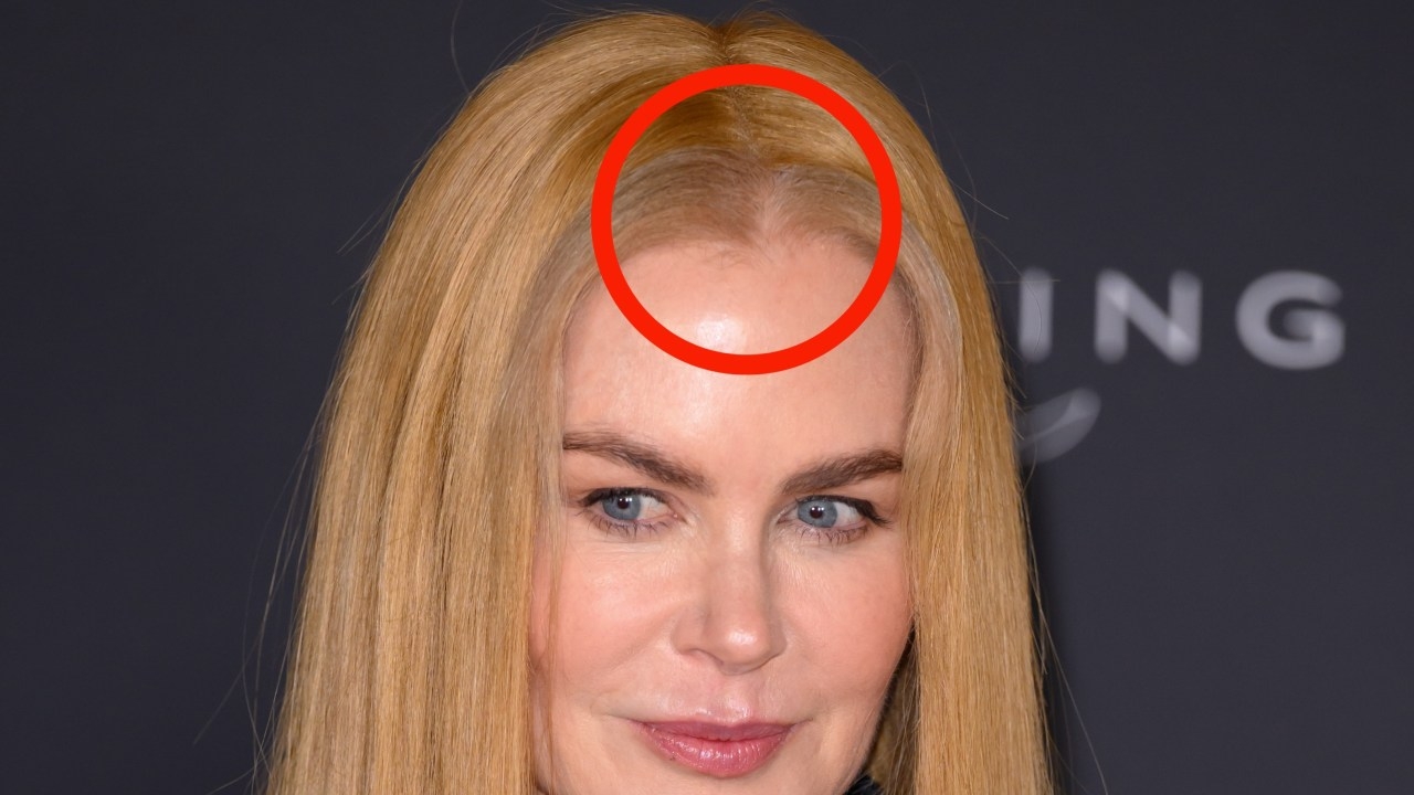 Nicole Kidman gets cosy with Nine Perfect Strangers co-star Henry Golding before suffering wig malfunction on the red carpet in Cannes