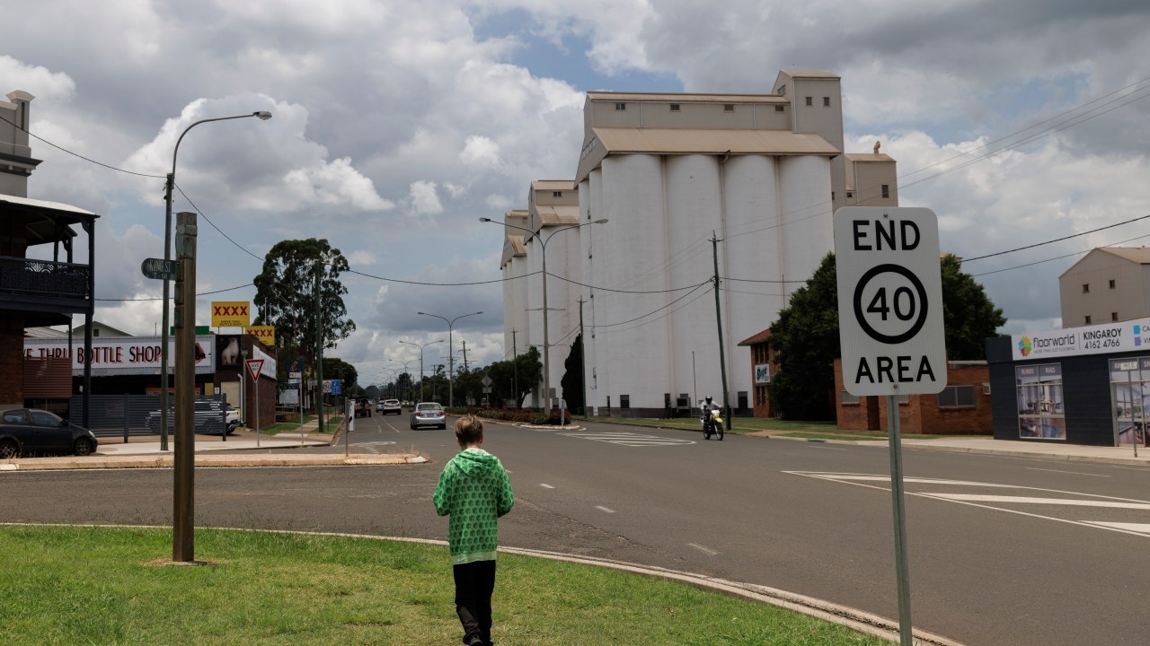 Gunman on the run in regional Queensland town after early morning shooting leads to school, hospital lockdown