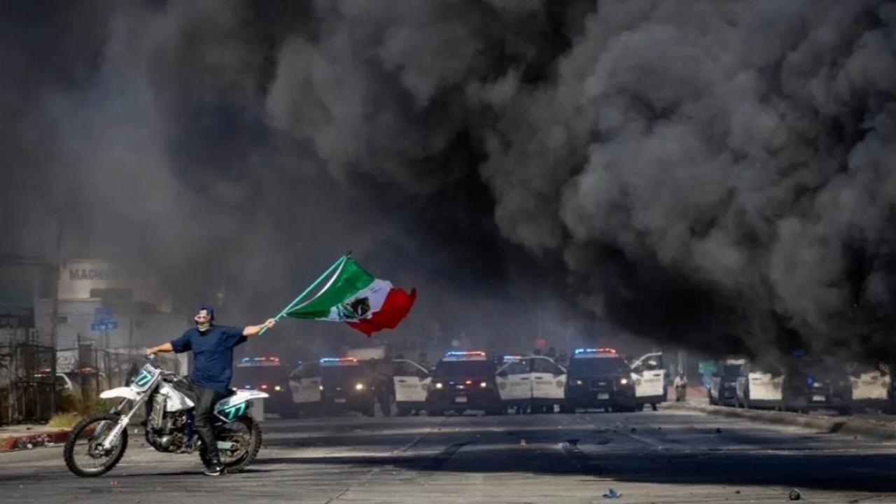 ‘Height of absurdity': Protestor photographed waving Mexican flag during LA riots