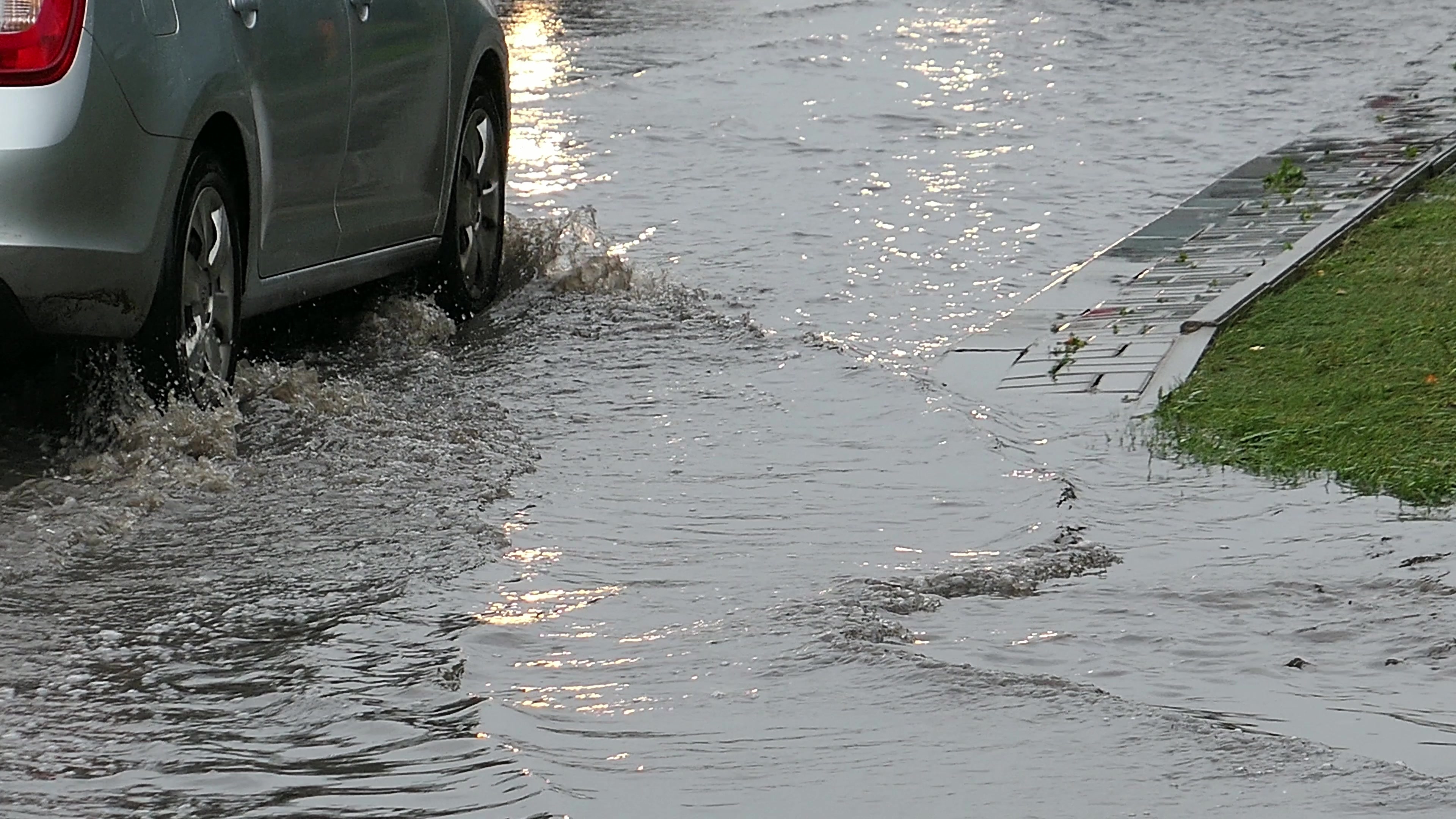 Video Shows Car Stuck in Floodwaters After City 'Smashed' Rainfall Record