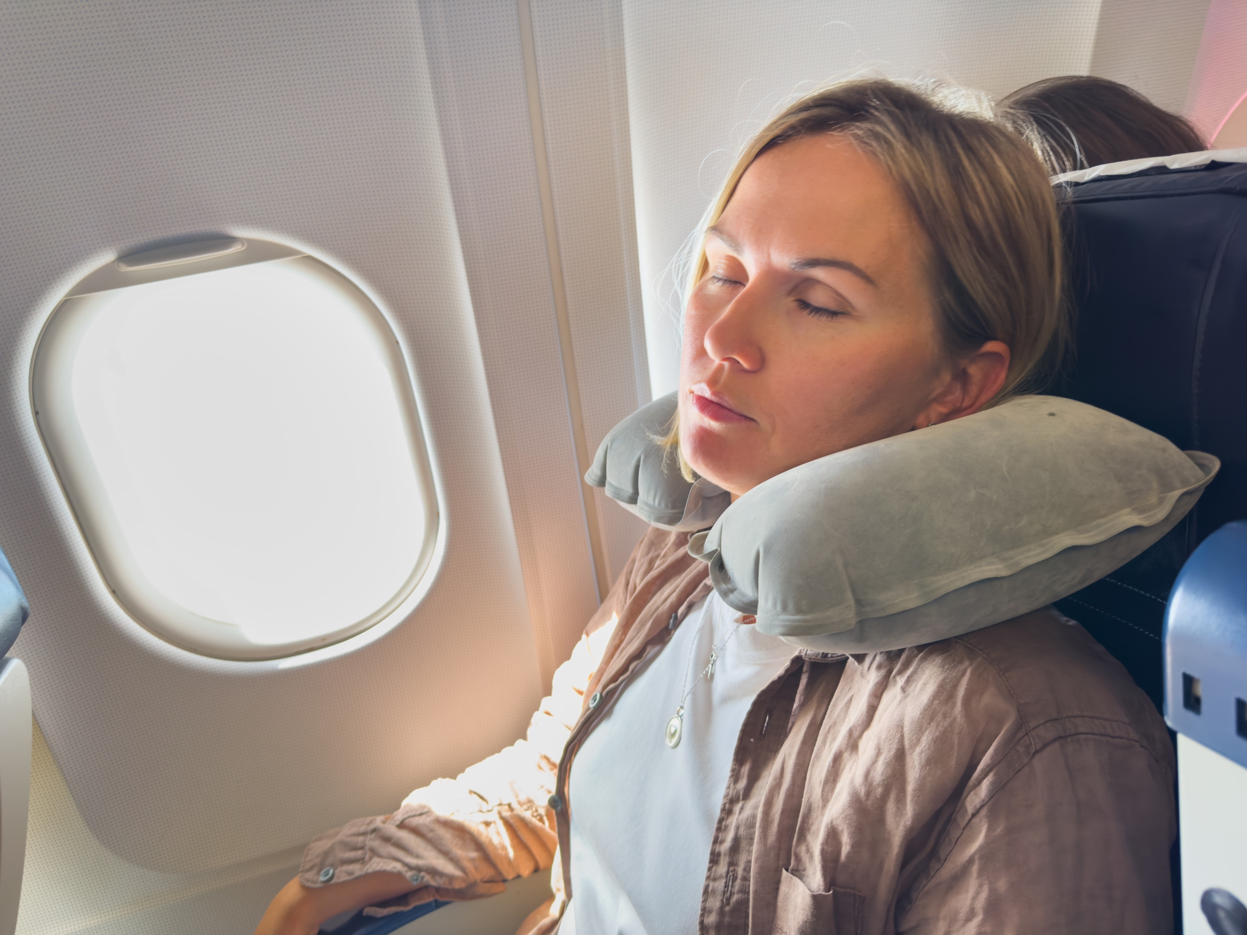 Woman Wakes Up on Plane, Can't Believe Who Is Sitting Next to Her