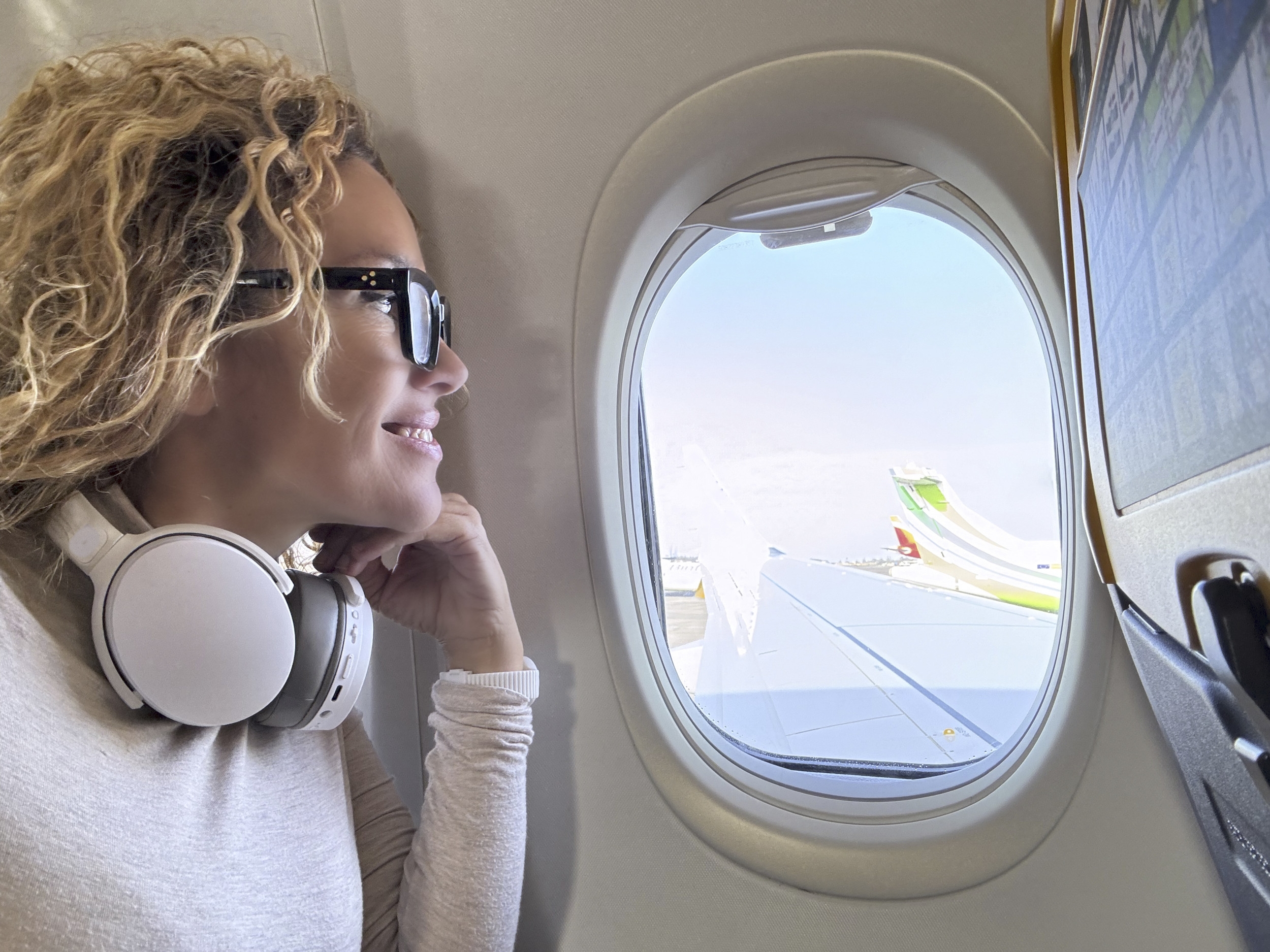 Gen Z Woman Refusing To Give Up Window Seat on Plane for Kid Backed