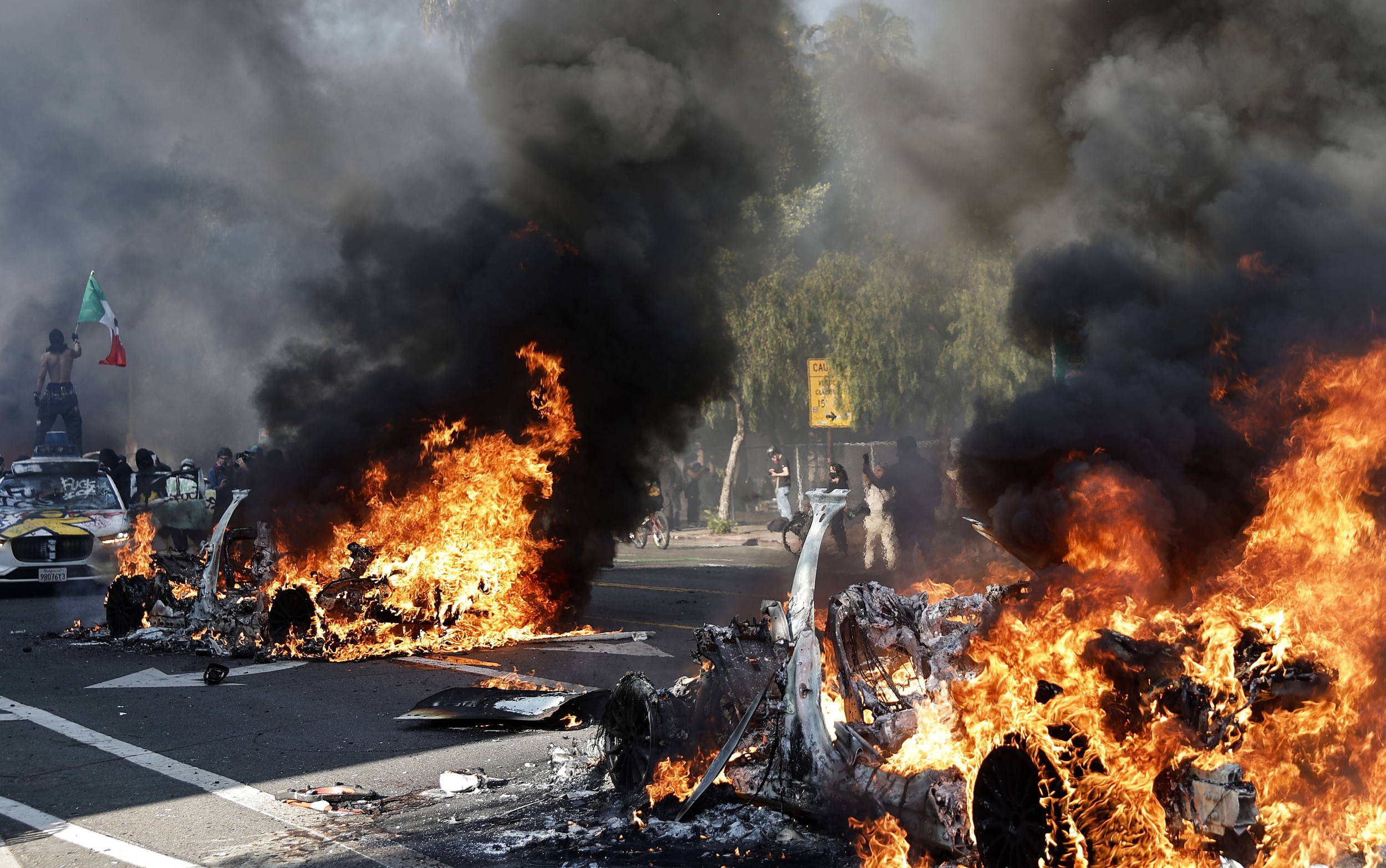 LA Riots: Multiple Police Cars Attacked By Protesters