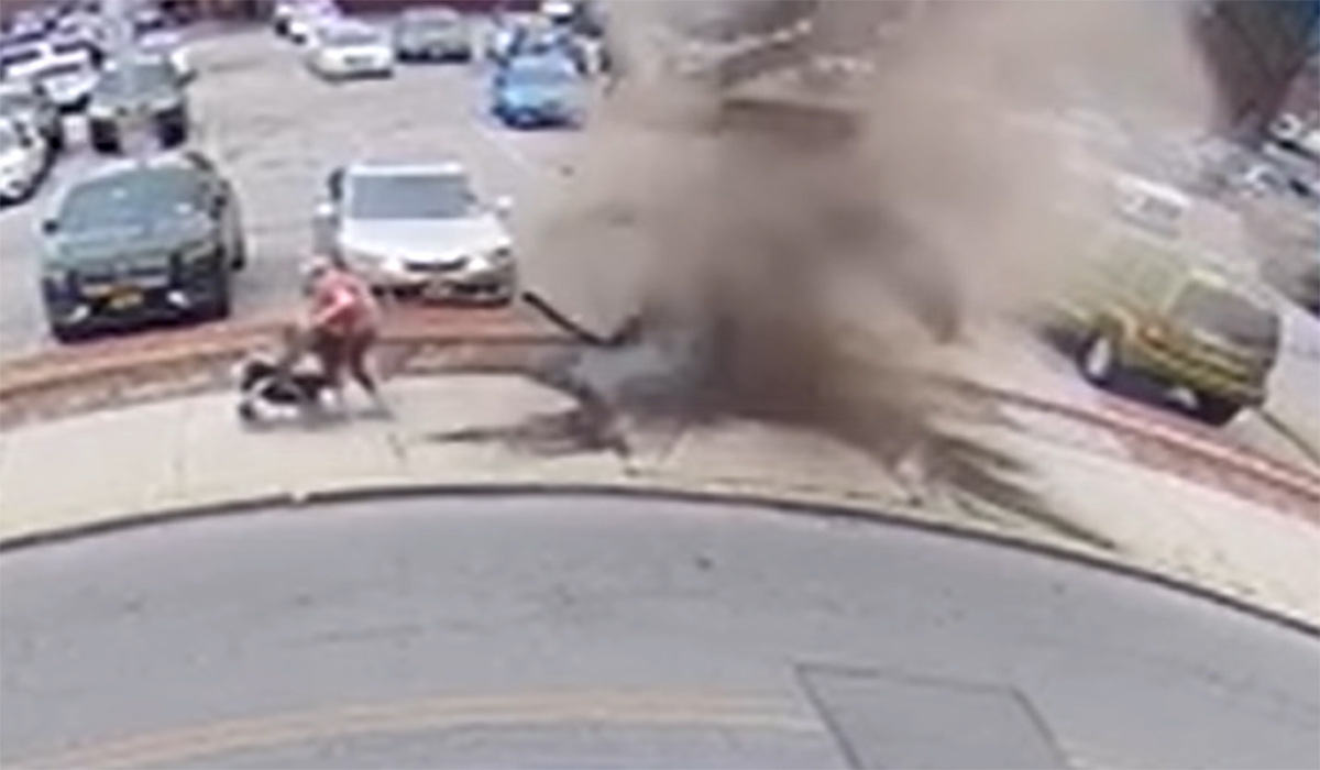 Watch: Woman and two kids narrowly escape manhole explosion