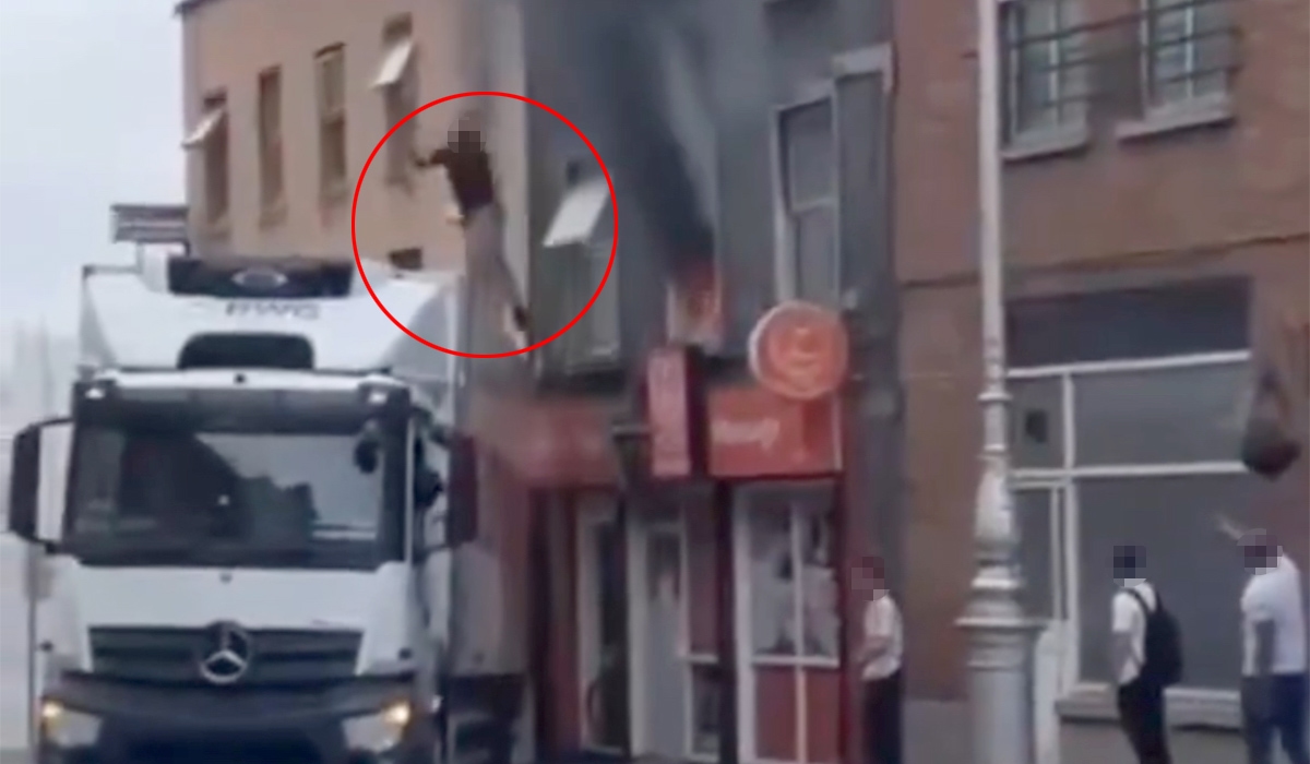 Watch: Moment lorry driver rescues man from burning building in Dublin