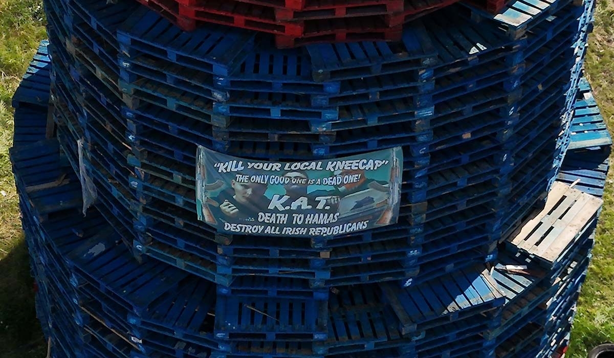 'Kill local Kneecap' poster appears on 12th of July fire in North