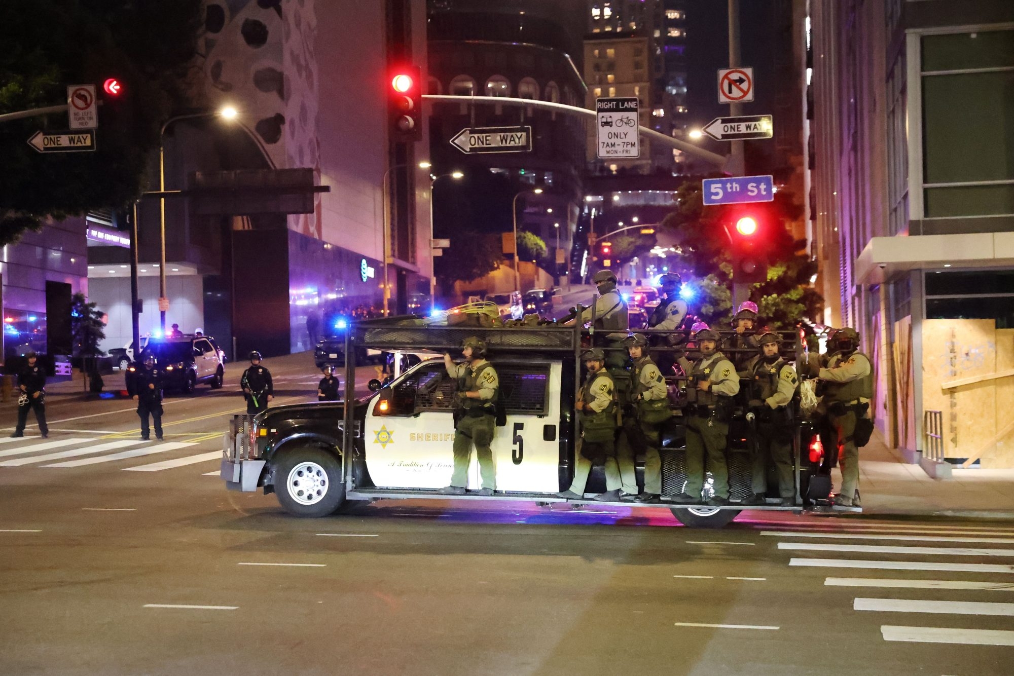 LA protests: police make mass arrests as city imposes curfew