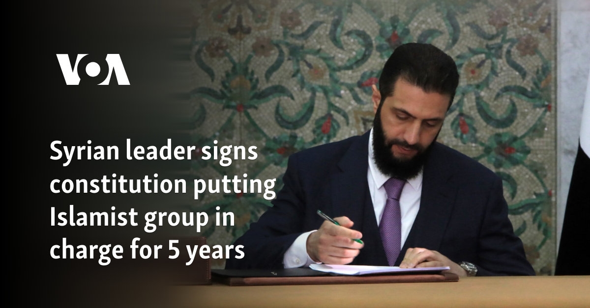 Syrian leader signs constitution putting Islamist group in charge for 5 years