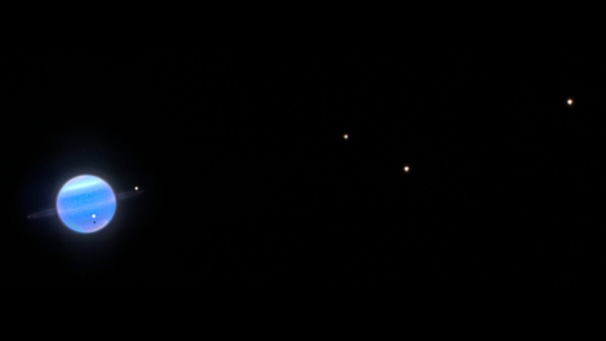 A Closer Look At Uranus's Moons Reveals a Surprising Dark Side