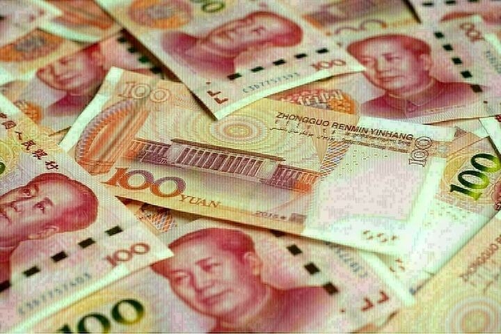 China's yuan slips against dollar