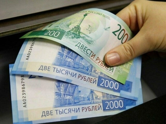 Rouble little changed against dollar