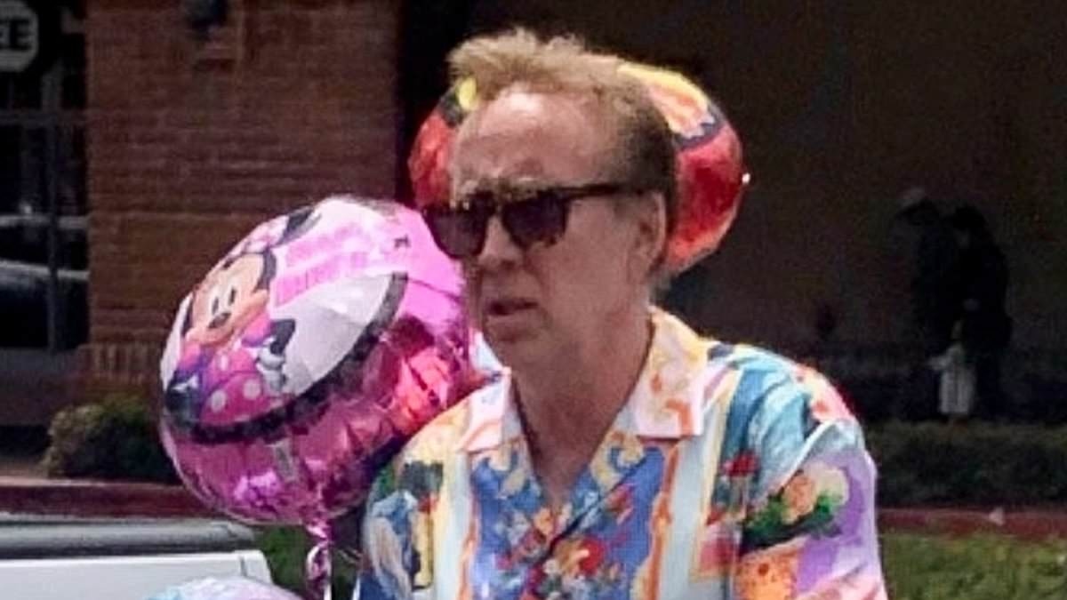 Nicolas Cage, 61, makes the rare move of wearing bright colors with PINK slides as he heads to a birthday party