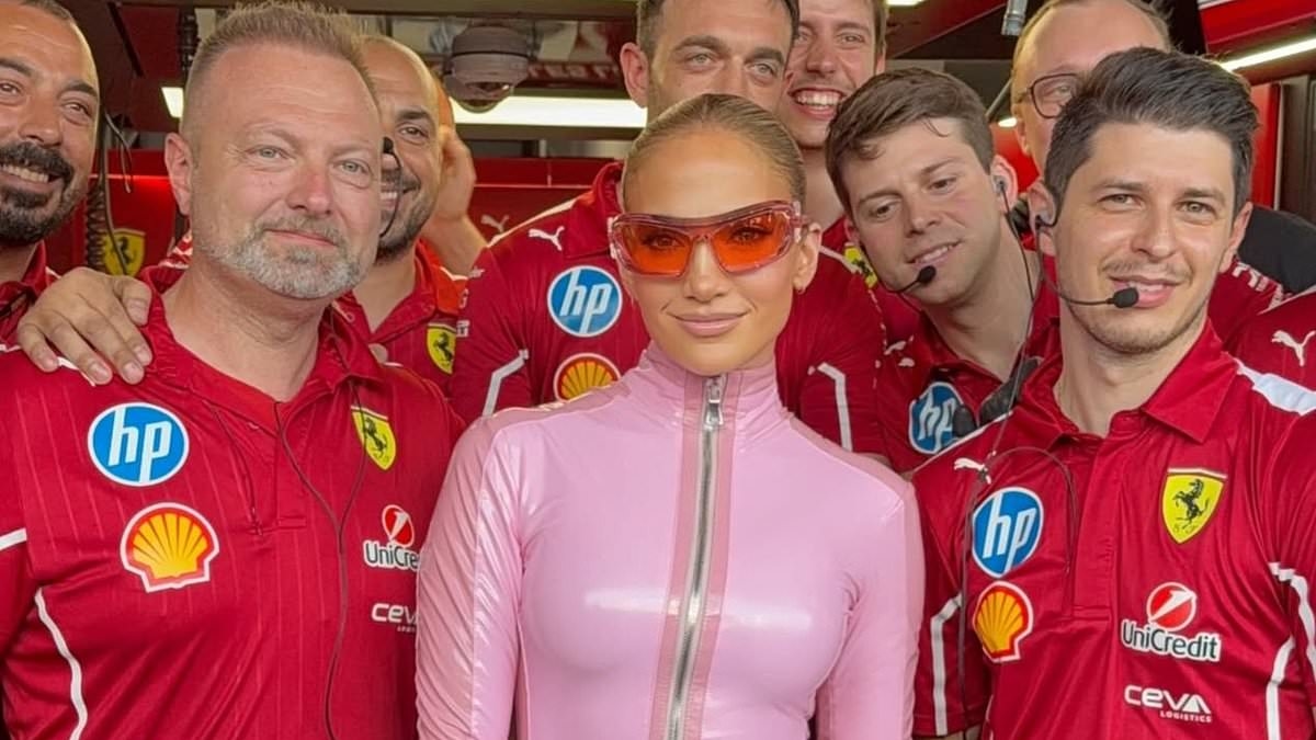 Fans spot awkward detail in JLo's Formula One picture after visiting Ferrari garage in skintight pink bodysuit: 'We all know what he's looking at'