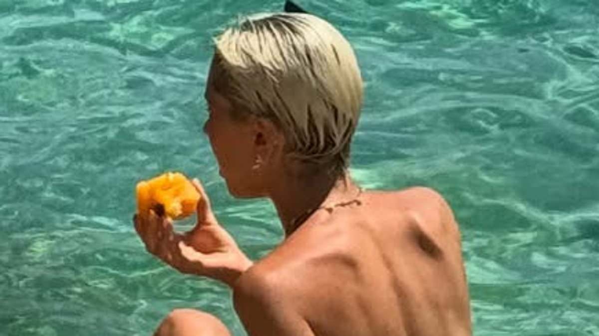Iris Law poses TOPLESS alongside a stunning pal while soaking up the sun in latest eye-popping photo dump