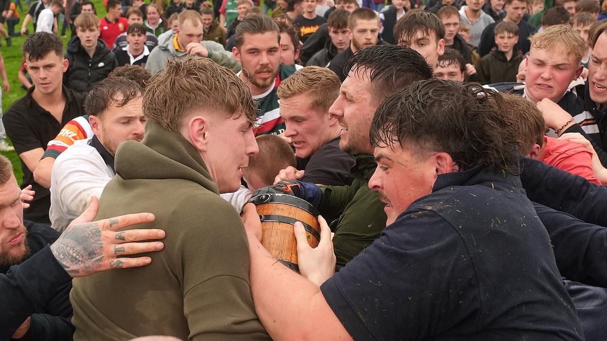 Villages go to war in annual 'bottle kicking' battle as hundreds turn out for Easter Monday tradition where locals 'fight to move barrels to streams'