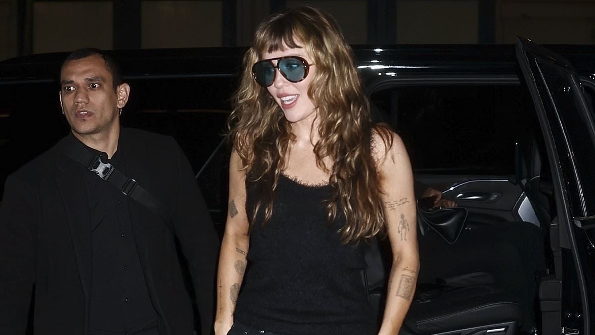 Blindsided Miley Cyrus emerges amid fears Billy Ray's romance with Elizabeth Hurley will ruin her big comeback