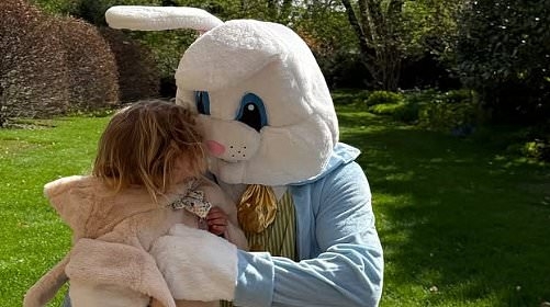 Rosie Huntington-Whiteley shares rare snaps of her children Jack, 7, and Isabella, 3, with an Easter bunny as they enjoy family weekend in the sun