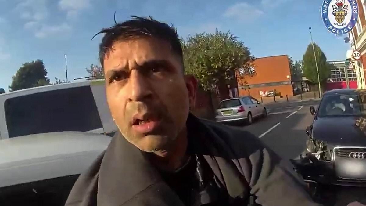 Moment banned driver ploughs into three police cars and nearly runs over officers in escape bid - before pleading for them not to hit him during arrest