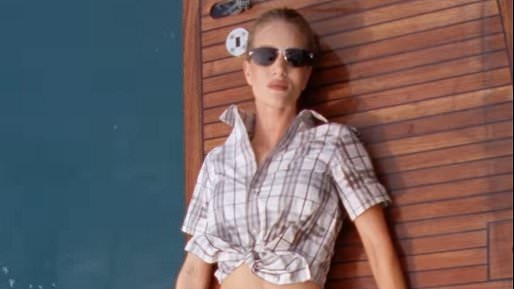 Rosie Huntington-Whiteley puts on a very leggy display in tiny bikini bottoms and a matching shirt for Burberry fashion campaign