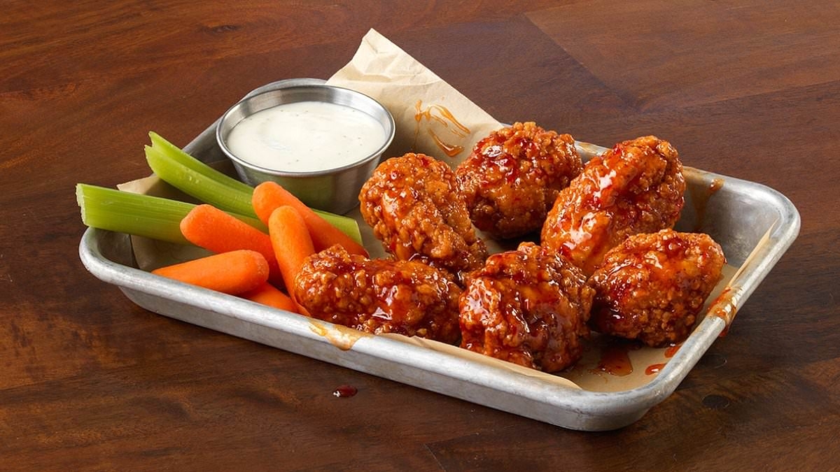 Chicken wing fans rejoice as iconic restaurant announces all-you-can-eat deal...but you'll need to act fast