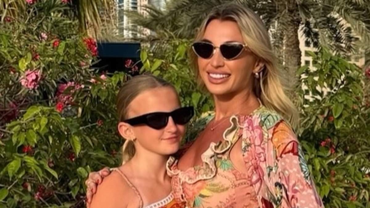 Billie Faiers flaunts her jaw-dropping figure in a stylish floral bikini as she poses with her mini-me daughter Nelly, 10, during family holiday in Dubai