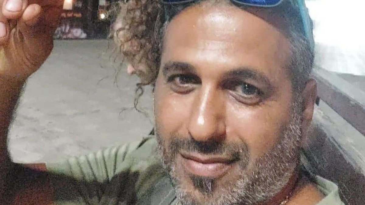 Family of father who was devoured by sharks off Israeli beach reveals he tried to fend off beasts with Go-Pro stick while attempting to film them in the water