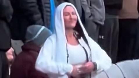 Female football fan has the perfect response to 'slapper' taunt as she flashes rivals supporters