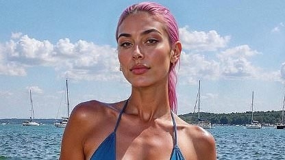 EXCLUSIVE Pink-haired, bikini-clad influencer rakes in £8,000 a month by posting sexy snaps - but all is not as it seems