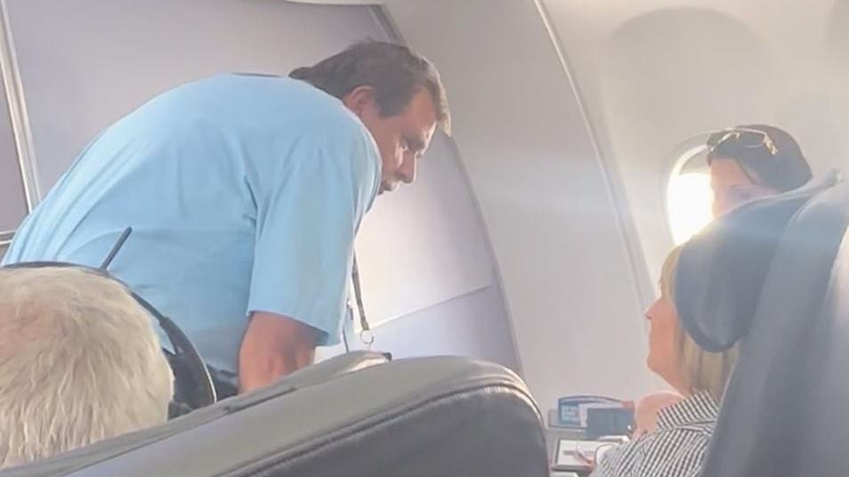 Flight attendant sparks fury after calling security on disabled passenger who she refused to help
