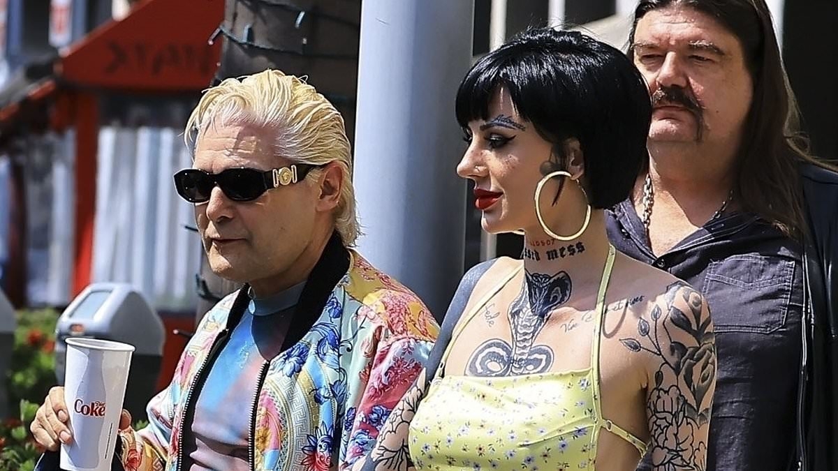 Corey Feldman turns heads in a floral bomber jacket as he steps out with new girlfriend Adrien Skye after splitting from wife Courtney Anne