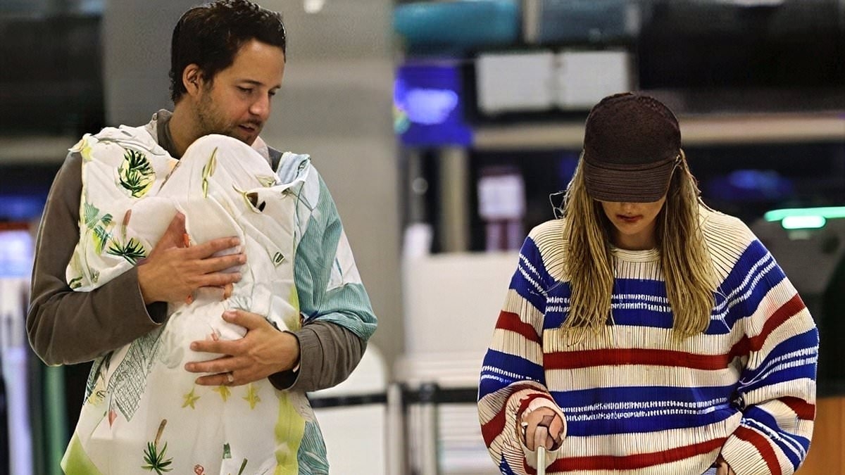 Margot Robbie looks effortlessly stylish alongside her husband Tom Ackerley as they are spotted in Brisbane with their six month old baby