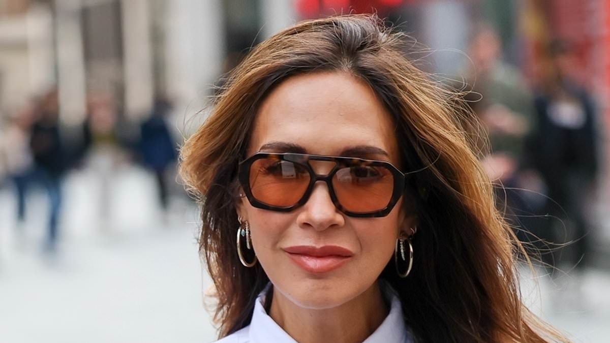 Myleene Klass, 47, puts on a very leggy display in black lace tights as she arrives Smooth Radio