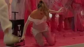 Lele Pons slips twice and falls hard during chaotic gender reveal as she expects first baby with Guaynaa