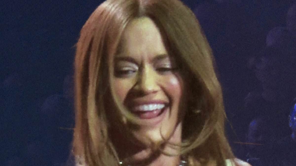 Rita Ora shows off her incredible figure in racy white bra and tiny shorts with tassel belt while performing as she supports Kylie Minogue on tour