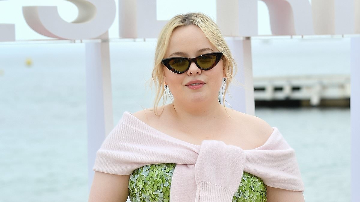 Nicola Coughlan is the epitome of chic in a green sequinned dress and shades as she leaves her handprints in cement during Cannes TV Festival