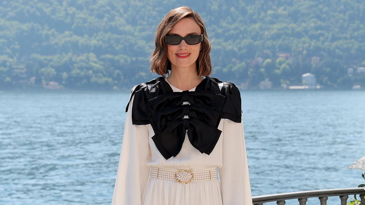 Keira Knightley looks effortlessly chic in a flowing white and black gown as she attends Chanel Cruise fashion show in Italy