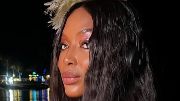 Naomi Campbell wows in skimpy yellow bikini as she shares rare snaps with her two children and friends while soaking up the sun during Maldives getaway