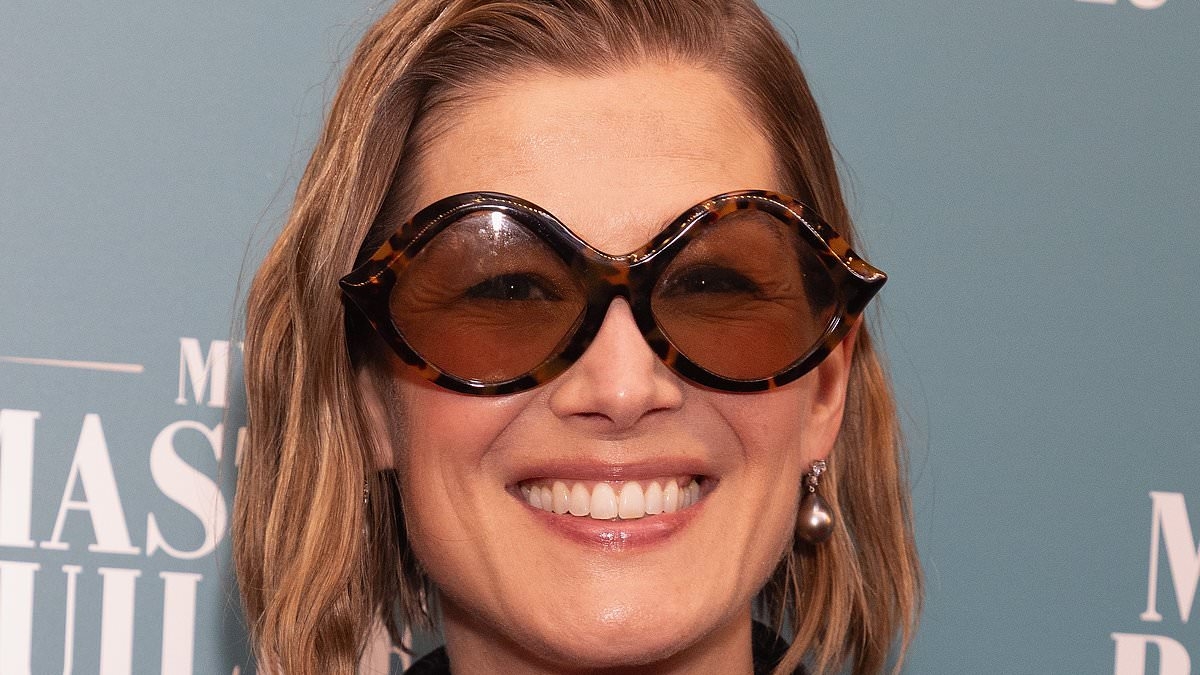 Rosamund Pike looks effortlessly chic in a black pinstripe suit as she supports Elizabeth Debicki at opening of her West End show My Master Builder