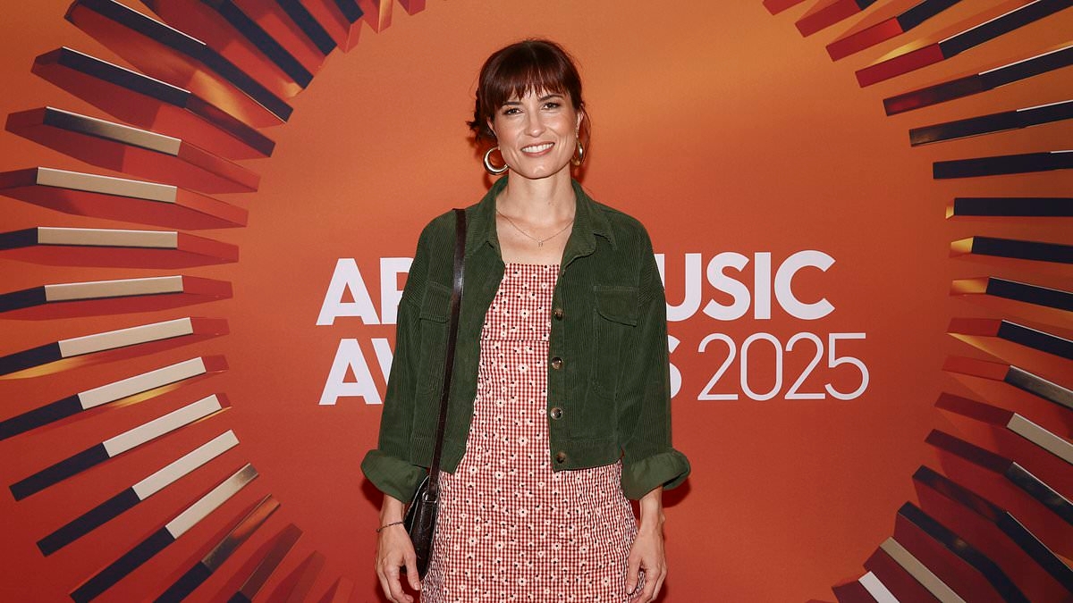 Missy Higgins cuts a flirty figure as she leads celebrity arrivals at the 2025 APRA Music Awards alongside Richard Wilkins in Melbourne