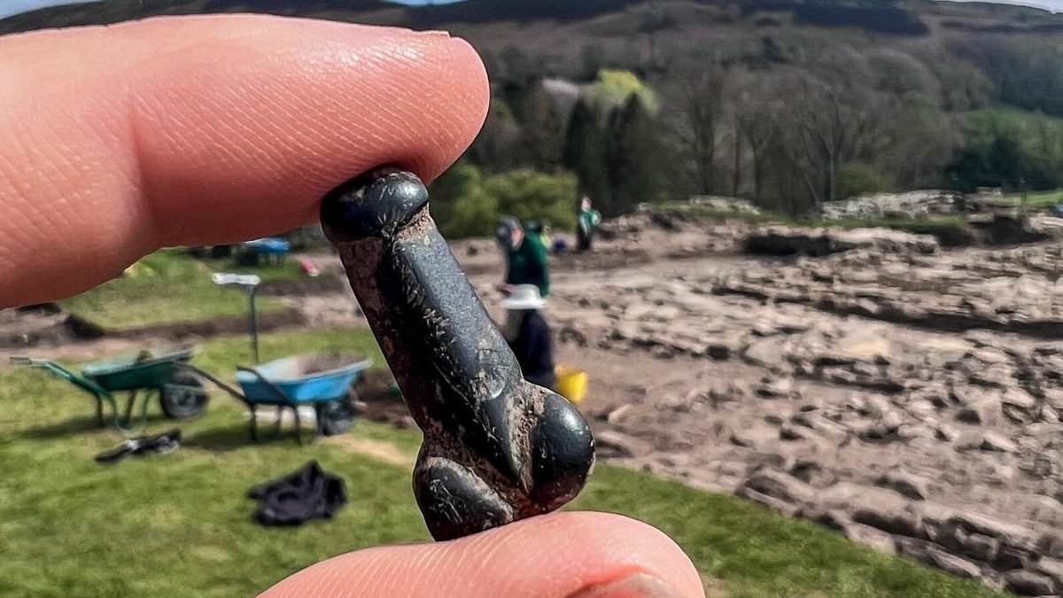 Archaeologists uncover a 'wonderful' 1-inch penis pendant at a Roman fort in Northumberland - and say it was probably a good luck charm for a soldier
