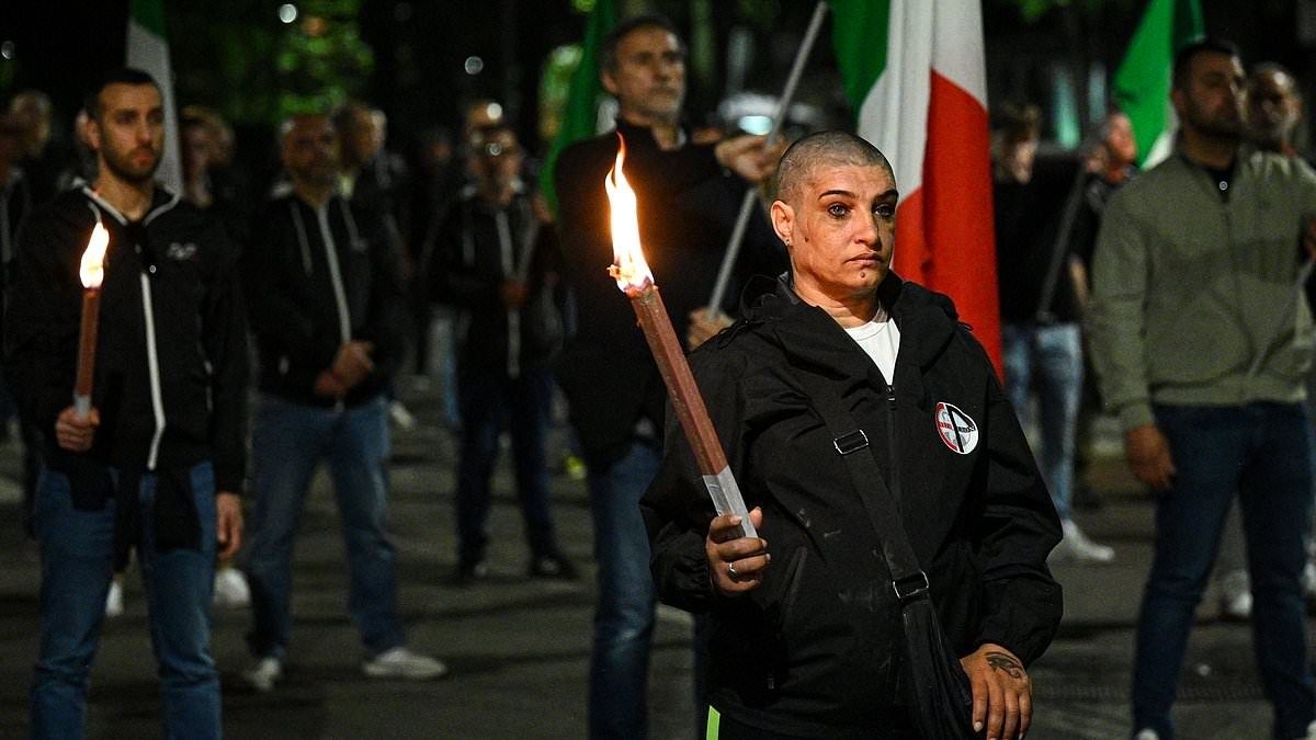 Thousands of extreme-right Italian neo-fascists hold torch-lit rally in honour of youth wing member murdered by far-left militants 50 years ago