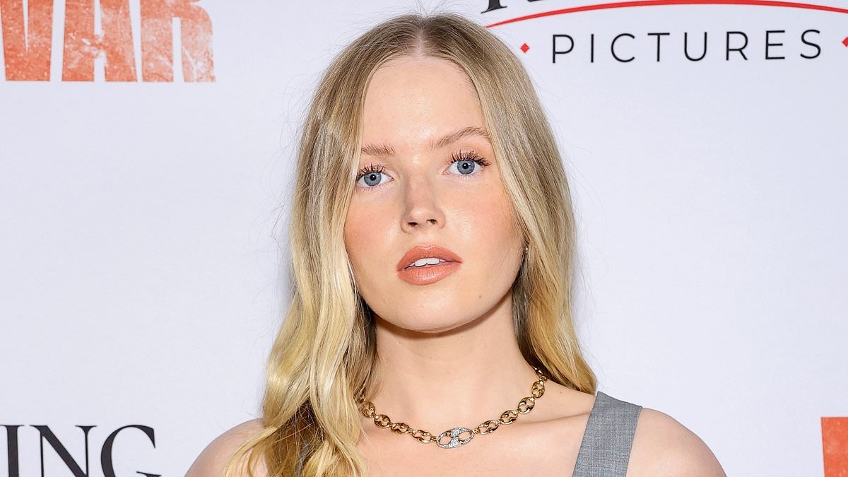 Ellie Bamber cuts a typically chic figure in a light grey skirt co-ord at the New York premiere of Words Of War