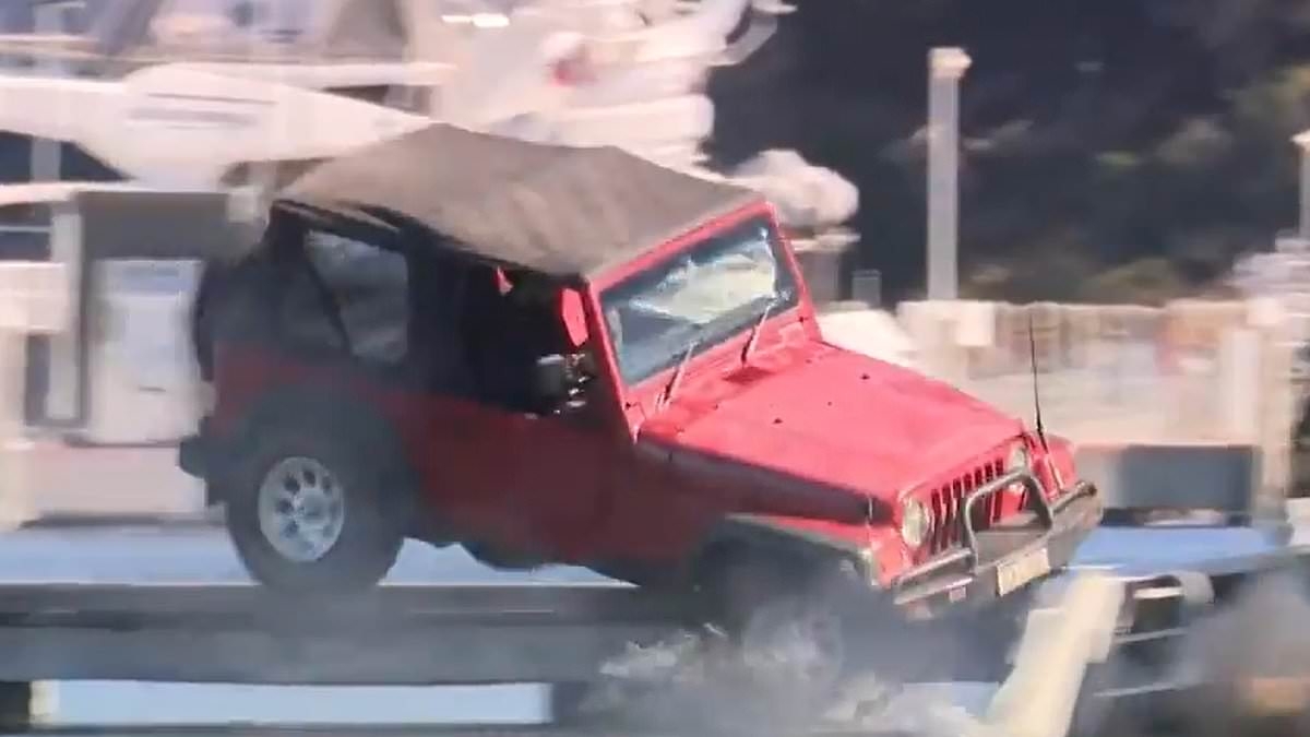 Dramatic scenes as driver plunges Jeep into river during tense stand-off with cops
