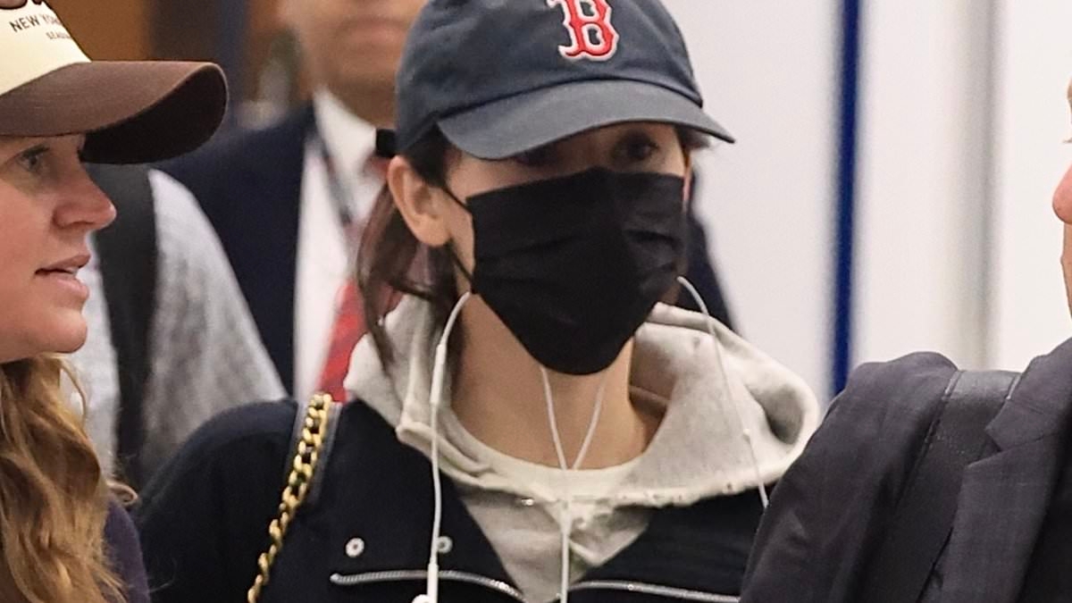 Grammy-nominated singer arrives incognito in Sydney ahead of highly anticipated tour Down Under - but there is no sign of her famous boyfriend after their public spat