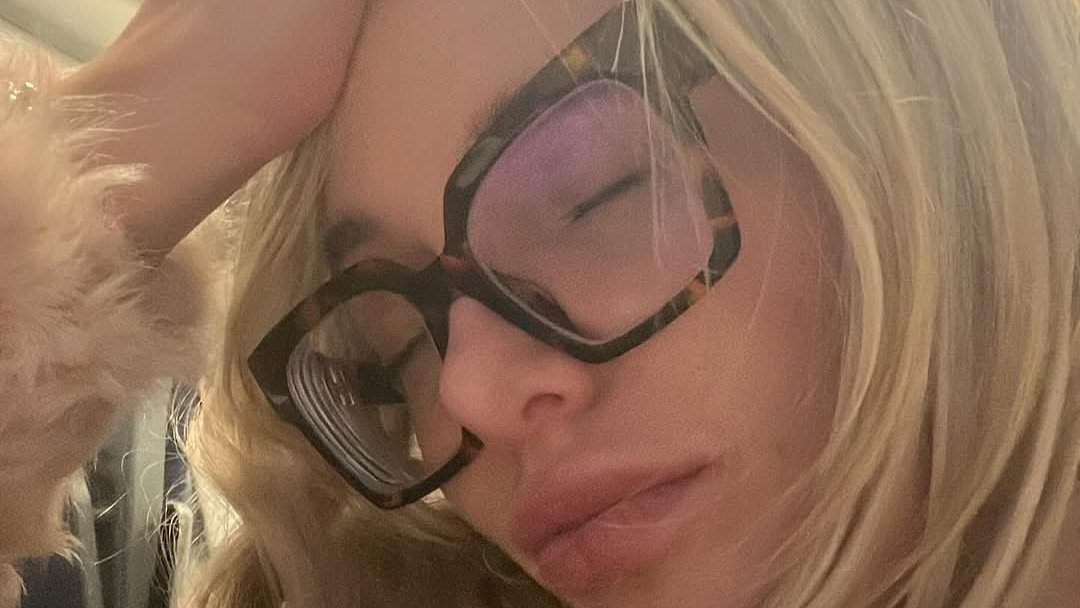 Helen Flanagan looks dejected as she holds her head in her hands during train journey - after admitting she's lost her £3.5m fortune and struggles to afford a cab