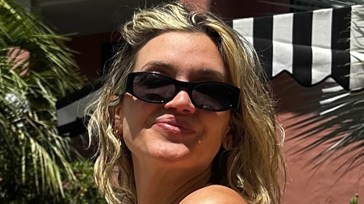 Ashley Roberts, 43, sends pulses racing in a skimpy pink bikini as she shares sizzling holiday pictures